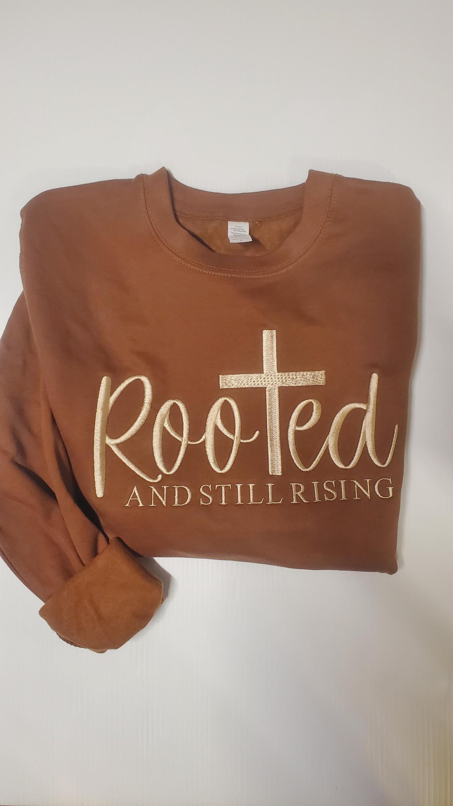 christian sweatshirt, clothing jesus gift, gift spiritual wear, wear blessed pullover, pullover church clothing, gift, gift religious wear, wear cotton sweater, sweater jesus king, king blessed mom, spiritual present,faith sweater, Easter Shirt
Brown crewneck sweatshirt featuring a faith inspired design with a cross and the words Rooted and Still Rising, made on a super soft comfortable sweatshirt available in multiple colors, inspirational Christian women’s pullover Angela Jasmina AJ Blanks