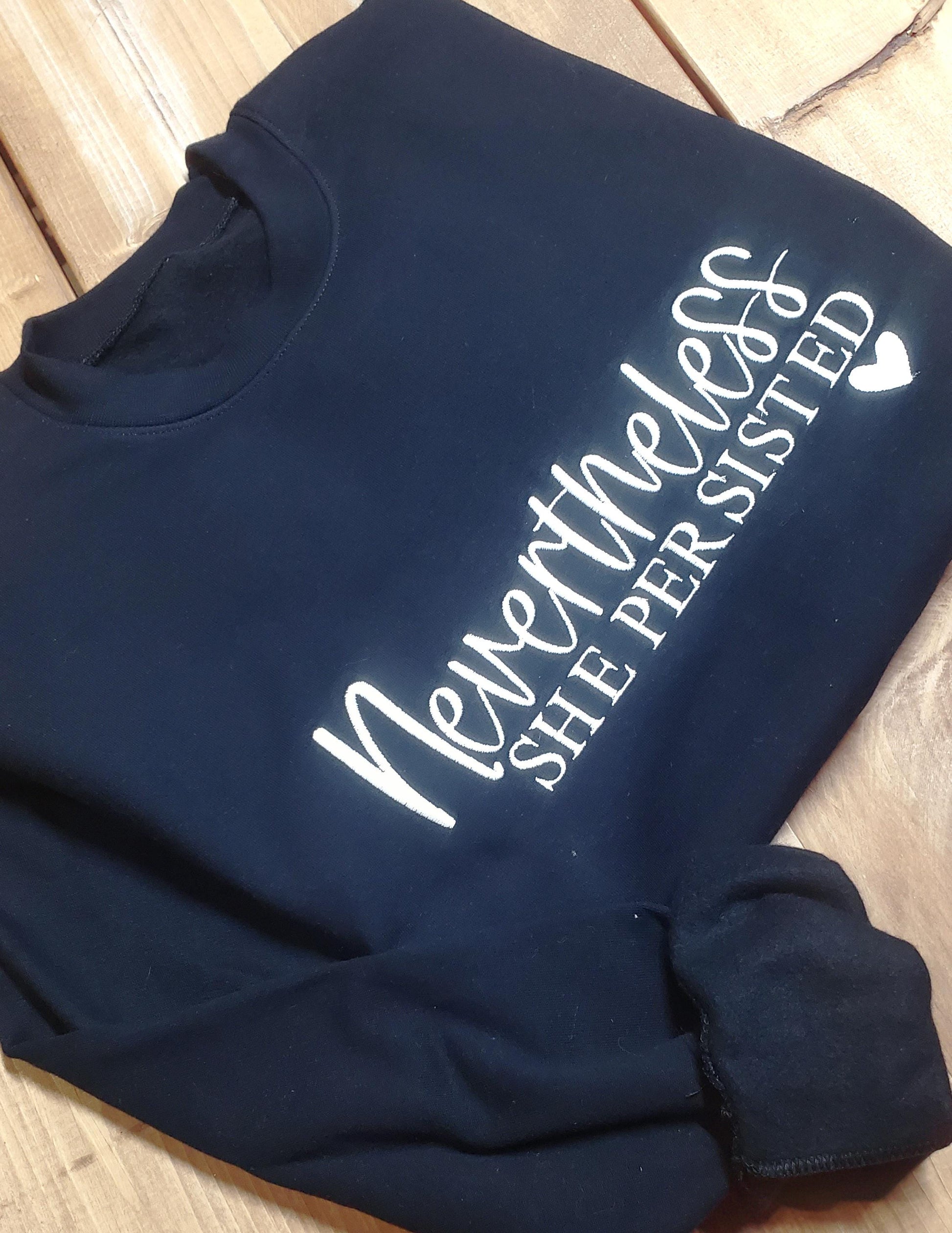 nevertheless shirt, she persisted, feminist sweatshirt, womens crewneck, inspirational top, custom sweatshirt, embroidered quote, strong women gift, cozy crewneck, womens pullover, empowerment shirt, faith inspired, motivational wear, gift for her, gift for mom, girlfriend gift, religious apparel, Angela Jasmina, ajblanks
